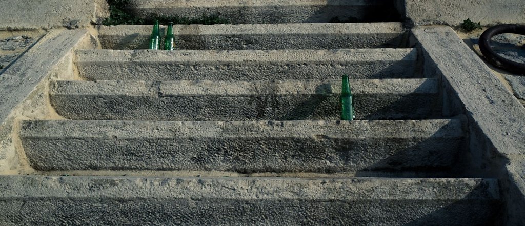 Empty beer bottles on steps, Arles